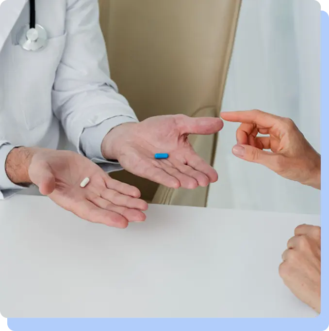 Doctor consulting with a patient while holding blue and white capsules, representing semaglutide treatment guidance and medical supervision.