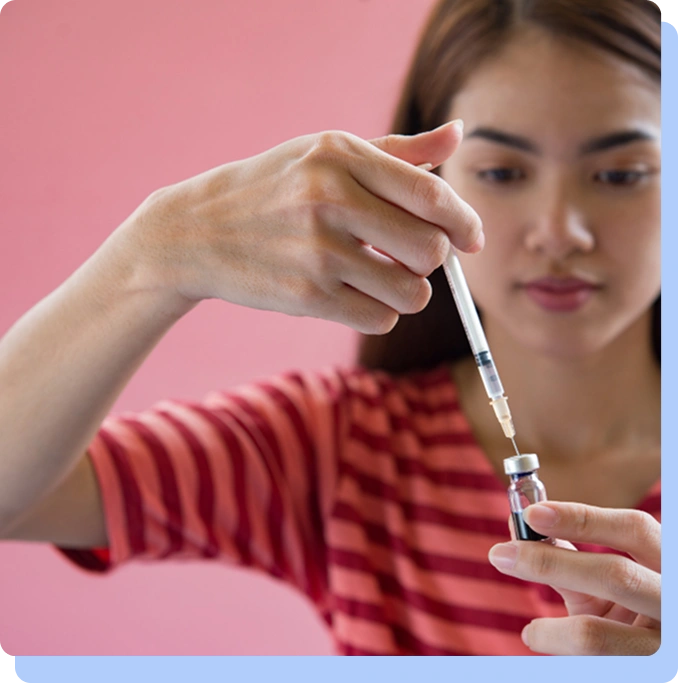 A close-up, focused shot of a person in a red striped shirt carefully drawing liquid from a small glass vial into a medical syringe. The person is looking down with concentration, and the image is positioned next to introductory text about GLP-1 receptor agonists.