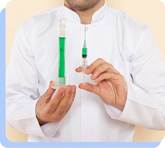 A medical professional holding two different sizes of syringes to illustrate the concept of gradual dose titration.