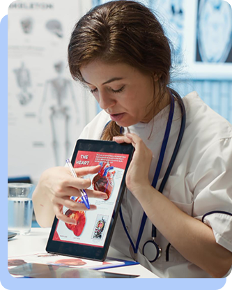 A female healthcare professional holding a tablet that shows a medical diagram of a heart and kidneys, pointing to the screen to explain the connection between the organs.